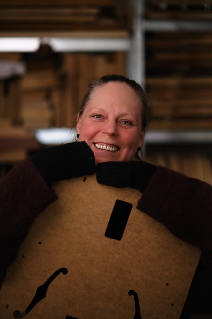 Kirsi from Archtop Laminates with a laminated archtop guitar body component